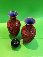 Pair of vases shown with reference apple to indicate scale