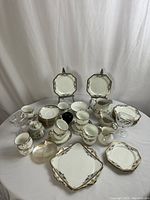 Full overview of porcelain pieces spread on table