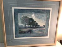 Framed monotype landscape painting showing trees by water with a reflection and sky above. The piece is titled "The Stream" and is signed by the artist.