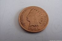 Obverse side of 1901 Indian Head penny showing Lady Liberty with feathered headdress and date.