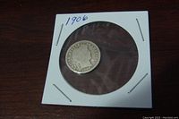 Obverse side of the 1906 D Barber Dime showing Lady Liberty profile.