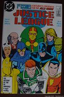 Front cover of Justice League #1 comic book showing multiple characters and colorful title