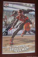 Photo of front cover of The Amazing Spider-Man #72 basketball variant comic book featuring Spider-Man and Venom characters in action.