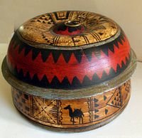 Top view of the hand-painted domed wooden box showing the detailed geometric and camel motif patterns on the lid and body.