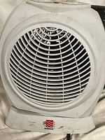 Close-up of heater front with brand logo visible, showing condition and vent details.