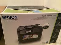 Epson WorkForce WF-7720 printer packaging with product image and branding.