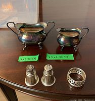 Full set on table with size markers showing creamer, sugar bowl, salt and pepper shakers, and napkin ring.