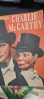 Front cover of the booklet showing Charley McCarthy dummy and Edgar Bergen in matching formal attire.
