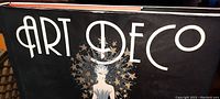 Cover of the Art Deco hardcover book showing title and illustration on dust jacket.