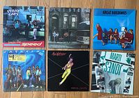 Photo showing six LP records: Stray Cats 'Built for Speed', Blue Steel promo copy, Great Buildings with photo & info sheet, Jackson 5, Max Webster (damaged cover), and Marti Jones.
