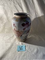 Front view of Japanese tall vase showing floral and bird hand-painted designs and overall shape.