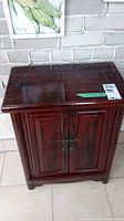 Front view of cabinet showing overall form and finish