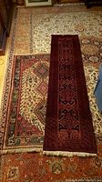 Area rug and runner side by side on floor