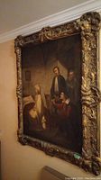 Full view of framed painting hung on wall