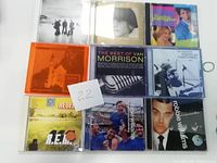 Image showing 9 CDs with visible front covers featuring various artists and album titles.