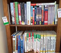 Shelf with a variety of textbooks including history, calculus, AP US History, SAT prep, and foreign language books.
