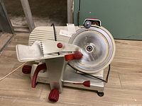 Overall view of slicer showing housing, blade mount and carriage