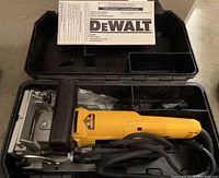 Top view of plate joiner and manual in open case