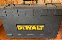 Closed black hard plastic carry case with DEWALT logo