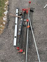 Overview of all clamps, levels, vices and ruler on driveway