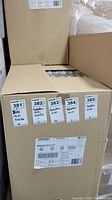 Closed cardboard shipping box labeled with Grodan branding and product details showing quantity and packaging format.