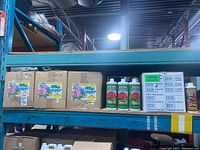 Three cardboard boxes of Bumper Crop pH adjustment solution on shelf