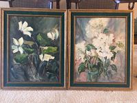 Pair of framed floral paintings by Verna side by side showing overall condition and frame style