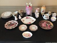 Full lot of assorted floral china and glassware including plates, vases, creamer, sugar bowl, and decorative bowls.