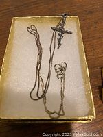 Sterling silver chain with cross pendant in gold tray