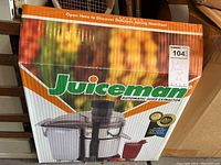 Box of Juiceman automatic juice extractor showing front with bright fruit image and branding