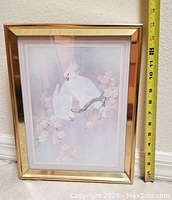 Framed acrylic painting of two white birds on a cherry blossom branch with a measuring tape showing about 14 inches in height.