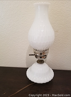 Full view of the vintage milk glass table lamp showing hobnail texture, scalloped base, metal holder and electrical cord.