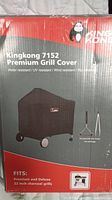 Photo of Kingkong 7152 Premium Grill Cover box showing cover on a 22 inch charcoal grill with features.