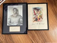 Overall view of the framed signed photo of Hattie McDaniel and framed Gone With the Wind playbill.