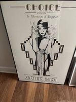 Full view of framed Josephine Baker poster featuring Art Deco style female portrait and event title