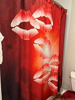 Shower curtain showing large lips design in red, white and black colors