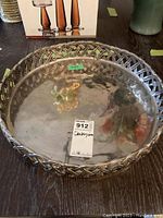 Full view of the metal centerpiece bowl showing shiny interior and woven rim design