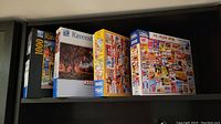 Photo of Ravensburger puzzle boxes showing autumn park scene and second box
