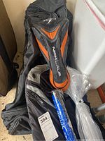Nicklaus golf bag showing the side with orange and black detail and the brand name clearly visible.
