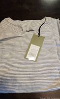 Goodfellow men's long sleeve sweatshirt with thin horizontal stripes, size large with price tag attached.