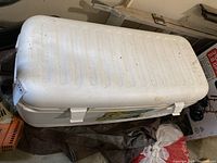 Top view of white Igloo Polar 120 Marine cooler showing dirt stains and some discoloration on the lid surface.