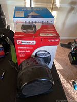 Crane humidifier box and Utilitech oscillating heater box with the heater unit in front