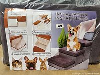 Installation instructions showing how to assemble the folding box stairs for pets including insertion of board pads and placing covers on the steps.