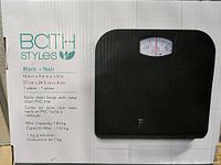 Photo of the box showing Bath Styles brand mechanical bathroom scale in black with specifications and dimensions.