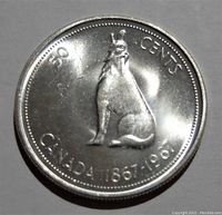 Obverse side of the coin showing a sitting wolf, inscriptions 50 CENTS and CANADA 1867-1967.