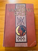 Front cover of the book titled 'The Vanishing Race' with detailed Native American portrait and decorative design