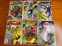 Photo showing six Spider-Man comic books from 1990 series including issues #6, #38, #39, #40, #44, and #47 featuring colorful covers with Spider-Man and villains.