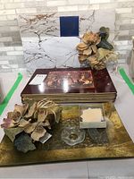 Decorative flower candle holders with glass candle wax catchers and large glass serving tray with gold design