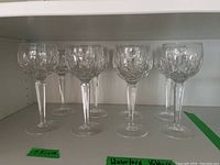 Eight Waterford Kildare crystal wine glasses displayed on shelf