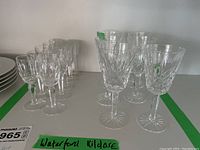 Photo showing side and front view of Waterford Kildare stemware including port and liqueur glasses arranged with green tape labeling.